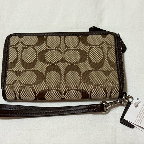 Coach Tan and Brown Signature Wristlet with defects. - Picture 2 of 5